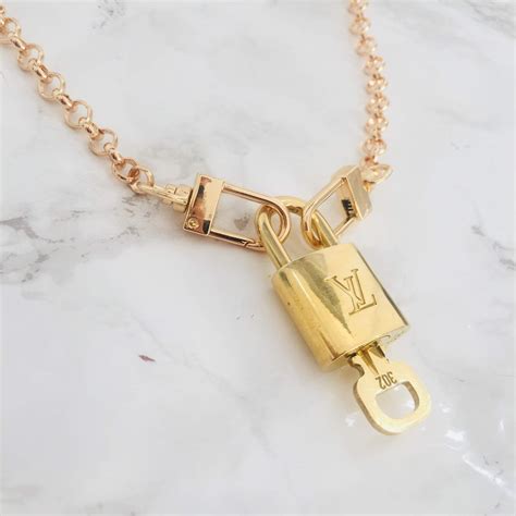 lv lock necklace gold|louis Vuitton Monogram locket necklace.